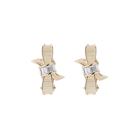 dalika: ribbon bow clip earring pale gold/crystal